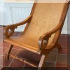 F09. Pair of wicker steamer chairs with matching ottomans. 